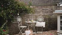 A vintage bistro table and barbecue await for those savouring the art of outdoor living in the warmer seasons