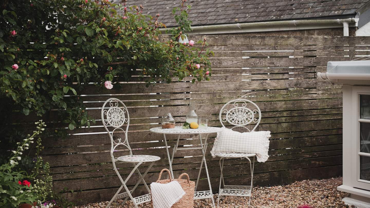 A vintage bistro table and barbecue await for those savouring the art of outdoor living in the warmer seasons