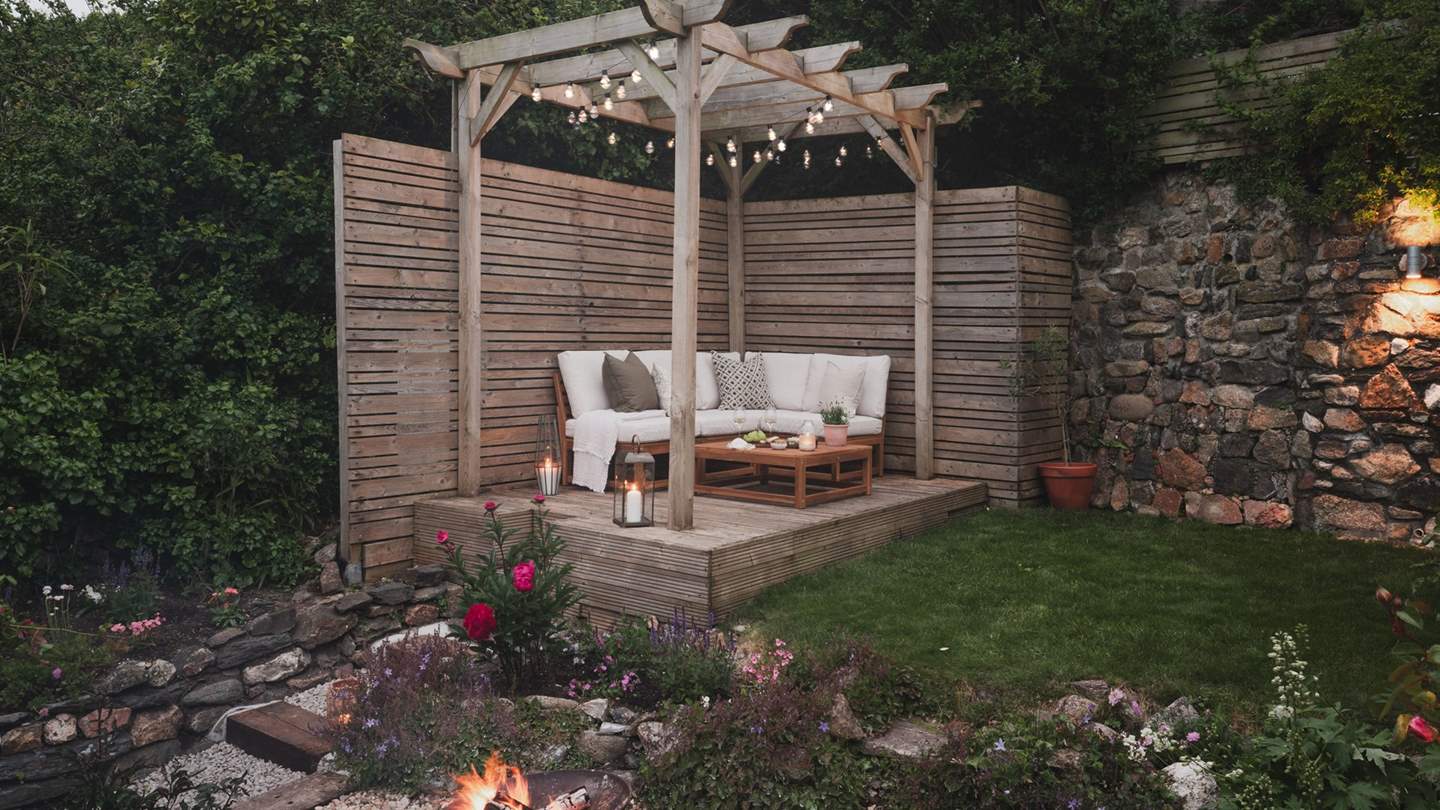 Uncover the enchanting tiered garden, complete with a firepit 