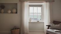 Admire soothing sea views from original sash windows...