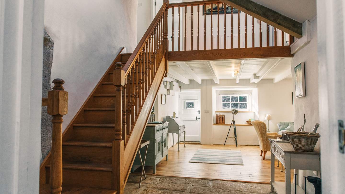 Take the stairs to discover two beautiful bedroom spaces