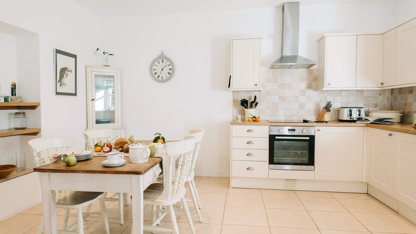 The charming, kitchen and dining space is simply a dream to craft and dine