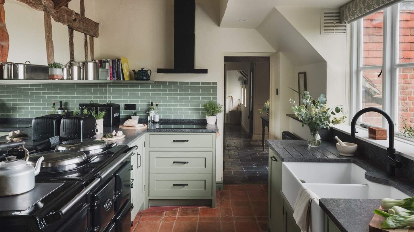 Terracotta tiles and exposed timber ensure a charming cottagecore-inspired setting