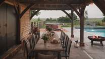 Unwind on the loggia, where up to twelve can dine with a romantic country backdrop