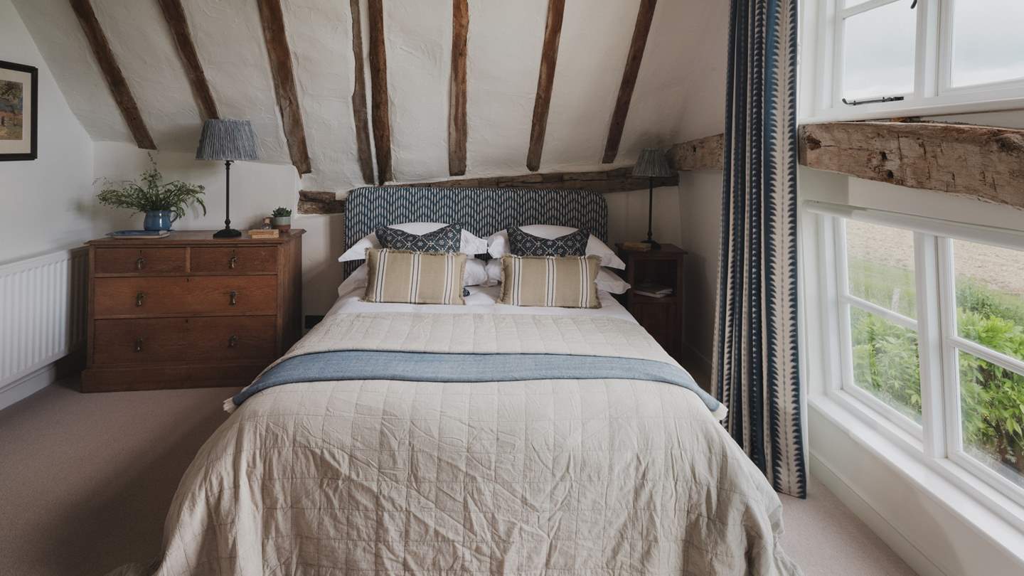 Exuding character, it features characterfully sloping ceilings and views across the courtyard garden