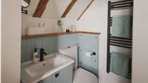 A blue-hued en suite promises a shower 