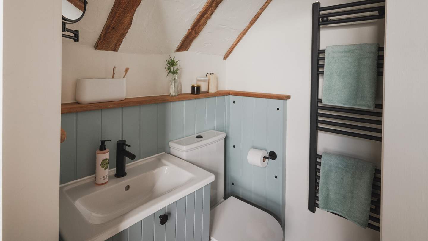 A blue-hued en suite promises a shower 
