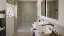 You'll also find a walk-in shower and dual sinks