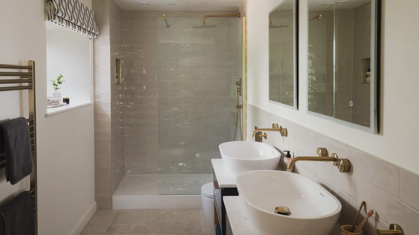 You'll also find a walk-in shower and dual sinks