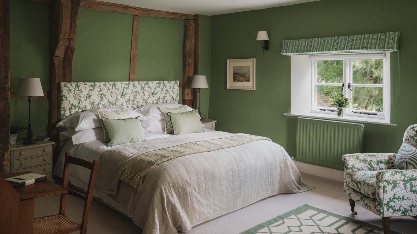 Gentle greens decorate the walls in this historic space