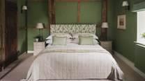 This space features a super king bed, along with two antique armchairs for relaxed contemplation