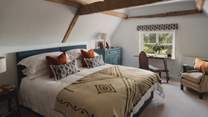 A sanctuary for slumber, rest and recline in the vibrant fourth bedroom 