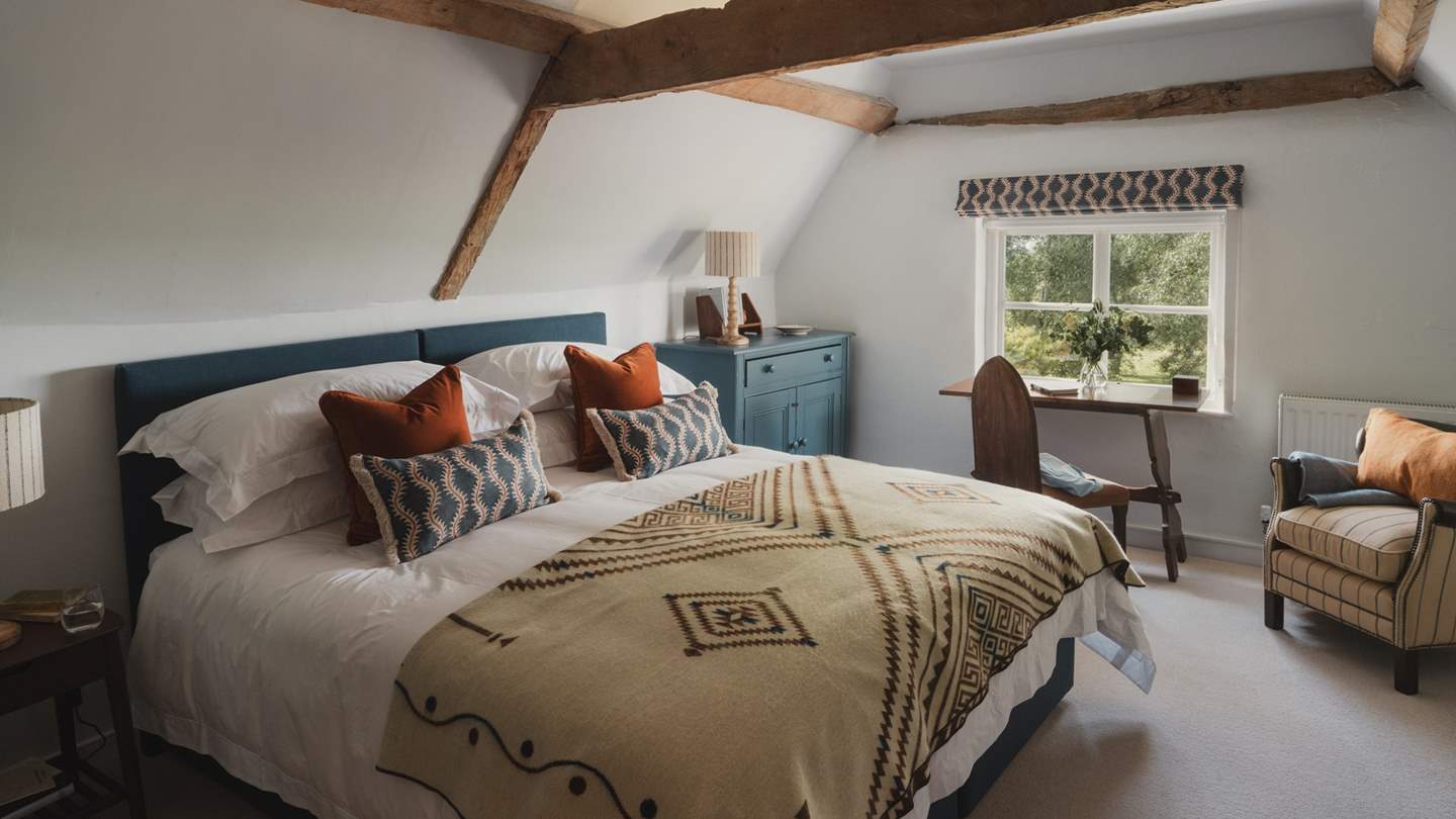 A sanctuary for slumber, rest and recline in the vibrant fourth bedroom 