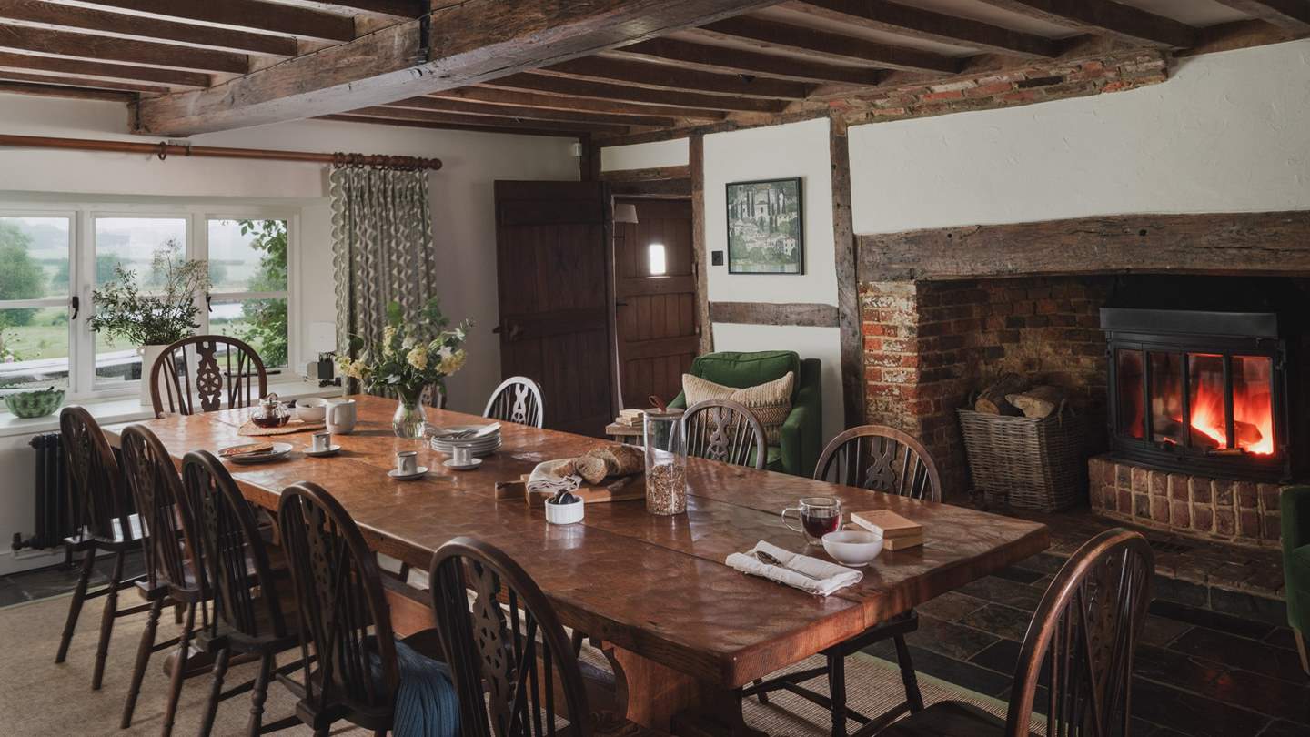 Next door to the kitchen, the dining room lends the perfect sense of occasion for delectable repasts accompanied by fireside charm