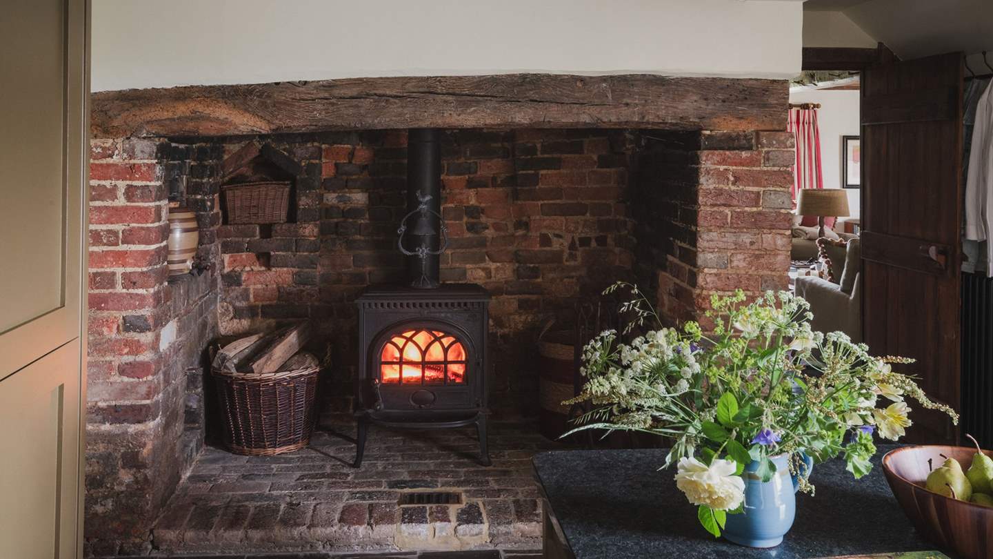 Discover a third wood burning stove, set within a red brick inglenook fireplace 