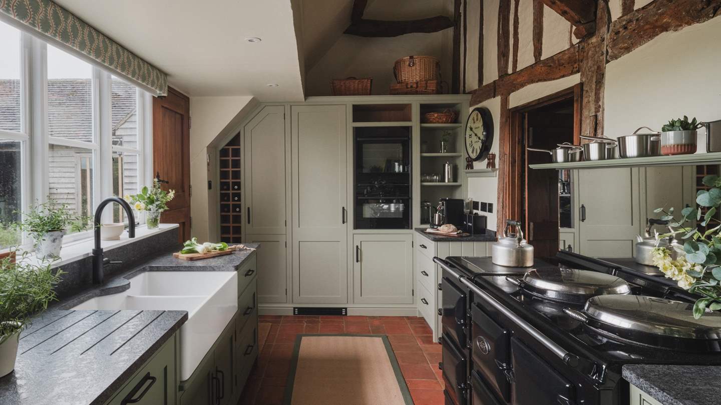 Exuding winsome appeal with characterful ceilings and original beams, the kitchen offers a welcoming space to craft meals