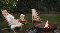 Settle into the Adirondack chairs with a cosy blanket and soaking up the warmth of the glowing fire pit