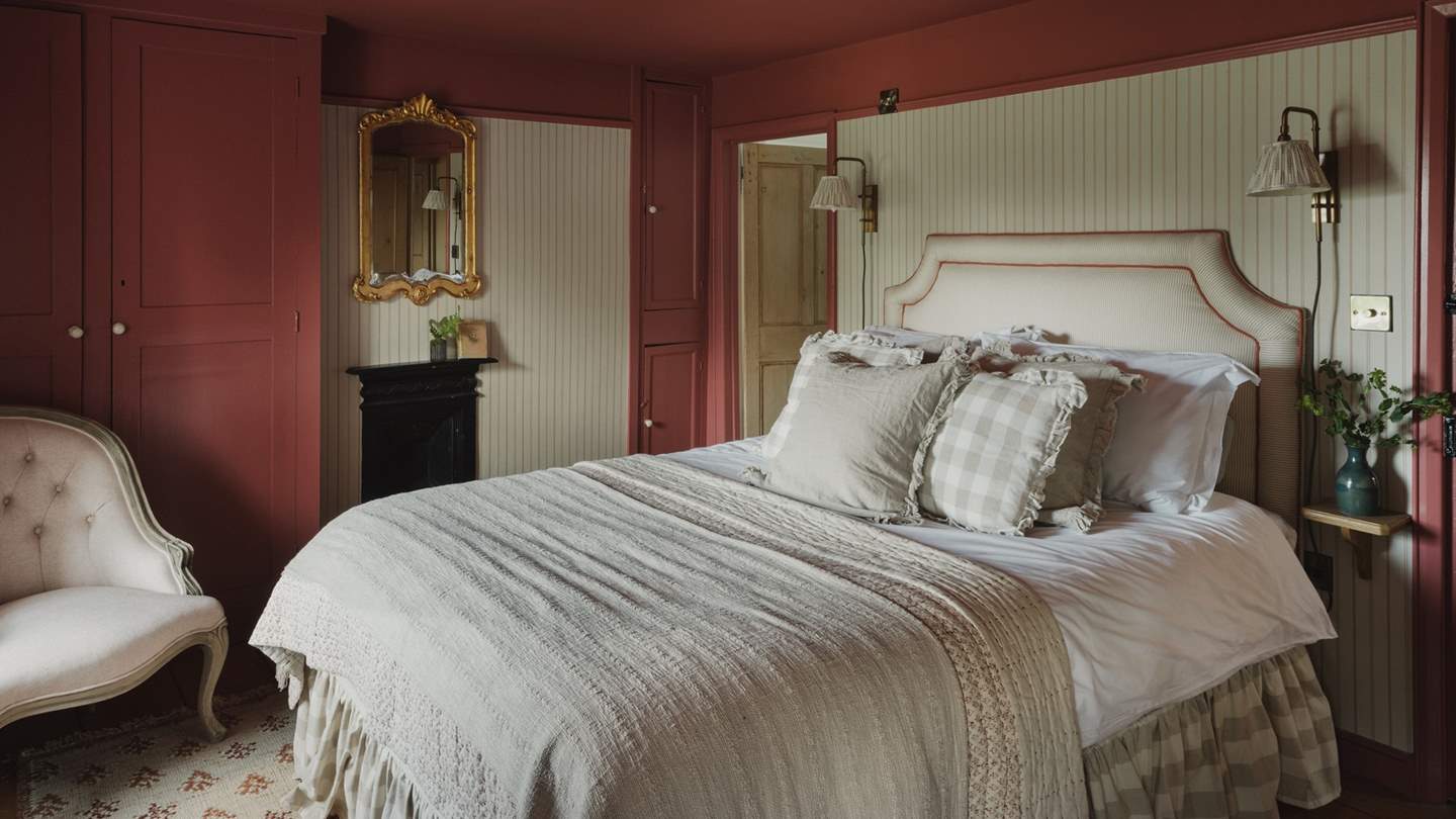 Dressed in a palette of blush hues, the master bedroom exudes understated elegance