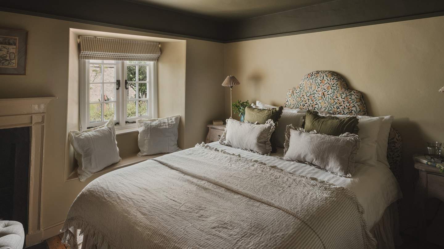 Beautifully styled in soft, earthy tones, the second bedroom offers a serene sanctuary