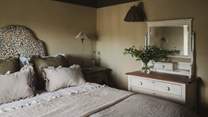 A chest of drawers provides storage