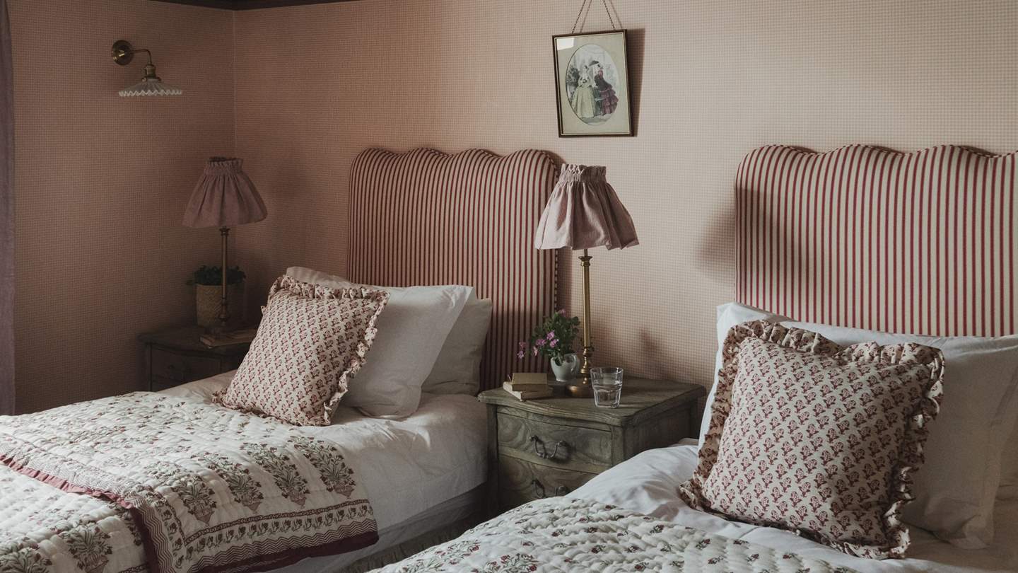 With dreamy pinstripe headboards, the twin beds can be set as a super-king for flexible sleeping arrangements