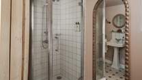 On the first floor, you’ll find the family shower room, with heated towel rail to keep towels fluffy and warm