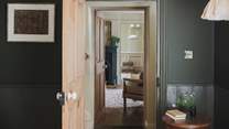 Beyond the traditional steep staircase, three beautiful bedrooms await on the first floor