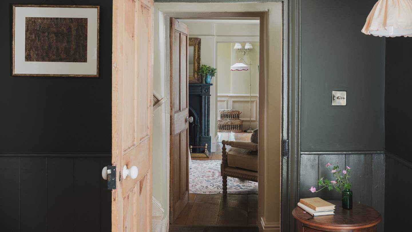 Beyond the traditional steep staircase, three beautiful bedrooms await on the first floor
