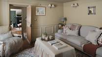 Drenched in buttery hues, a separate sitting room invites moments of calm
