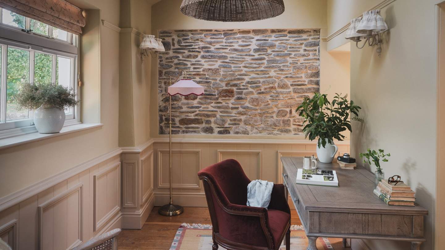 At the far side of the room, a charming writing desk awaits, should you need to catch up on an email or two 