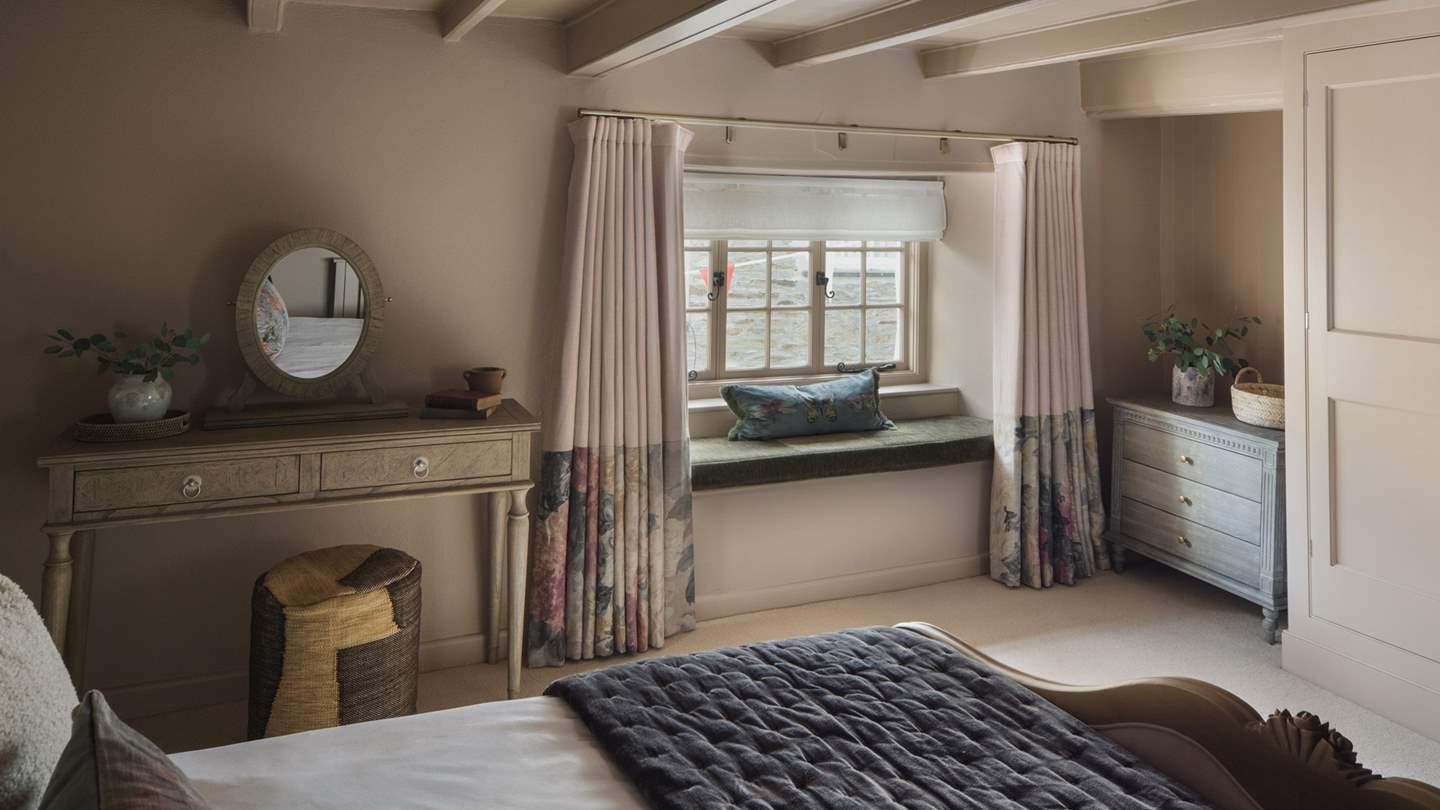 Featuring a super king bed, you’ll also find a dressing table with a stool