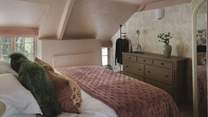 Uncover a dreamy blush palette with floral inflections in the third bedroom