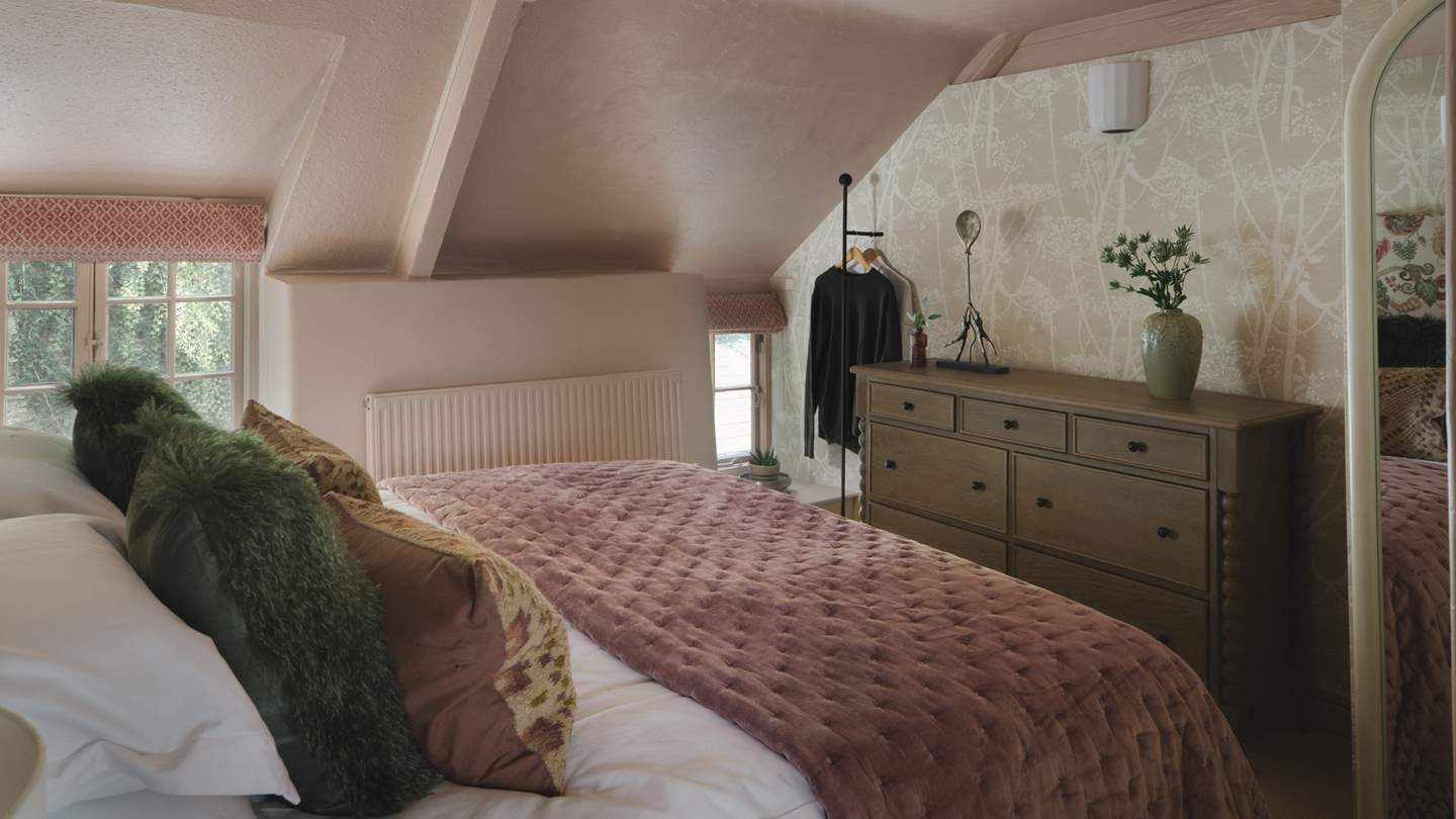 Uncover a dreamy blush palette with floral inflections in the third bedroom