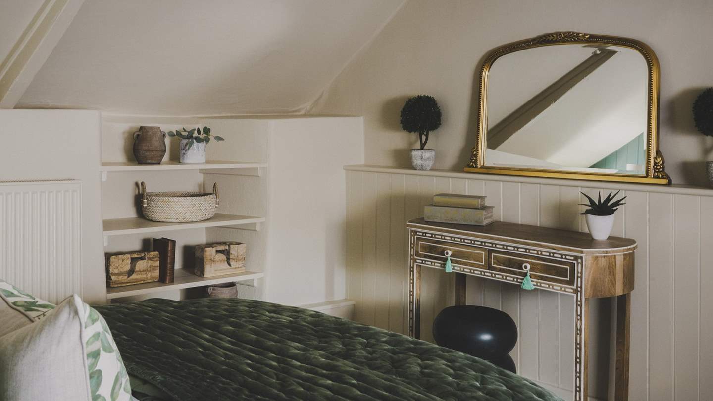 You’ll find two bedside tables, wardrobe, chest of drawers for storing your belongings in this elegant space