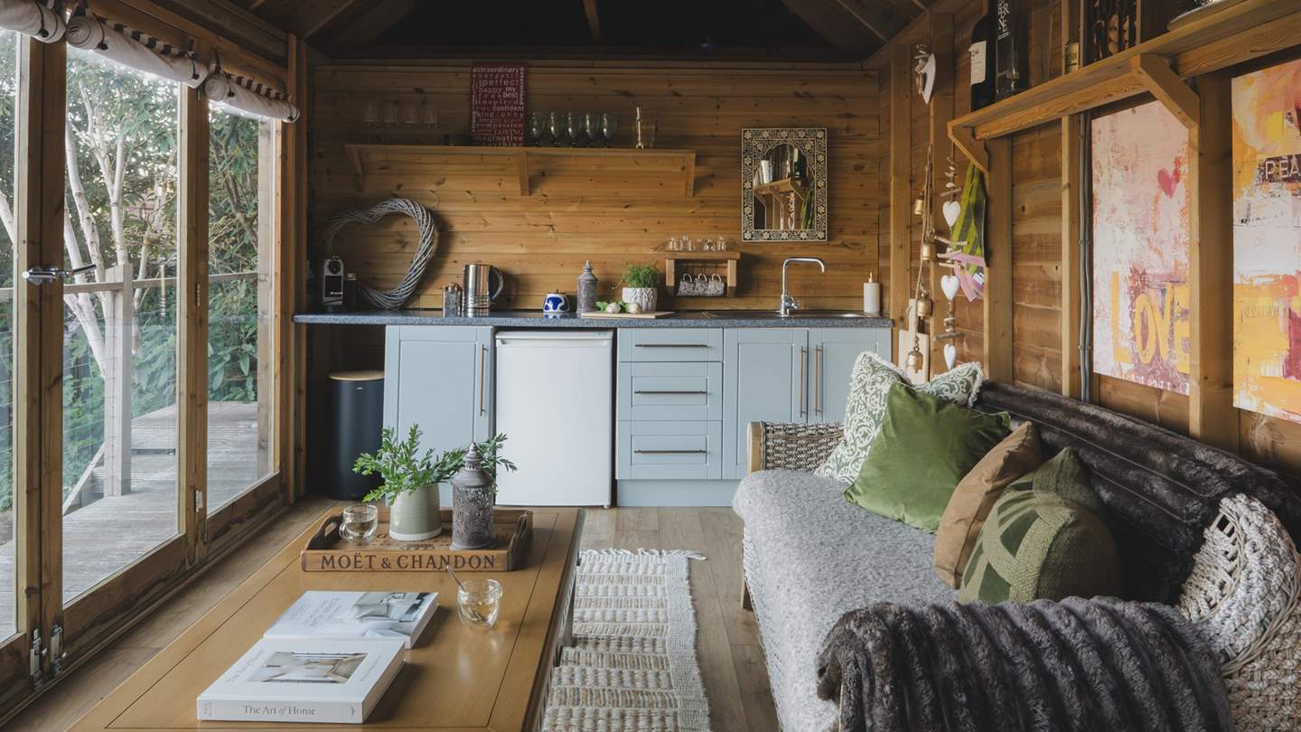 Inside, you’ll find a cosy sofa and small kitchenette