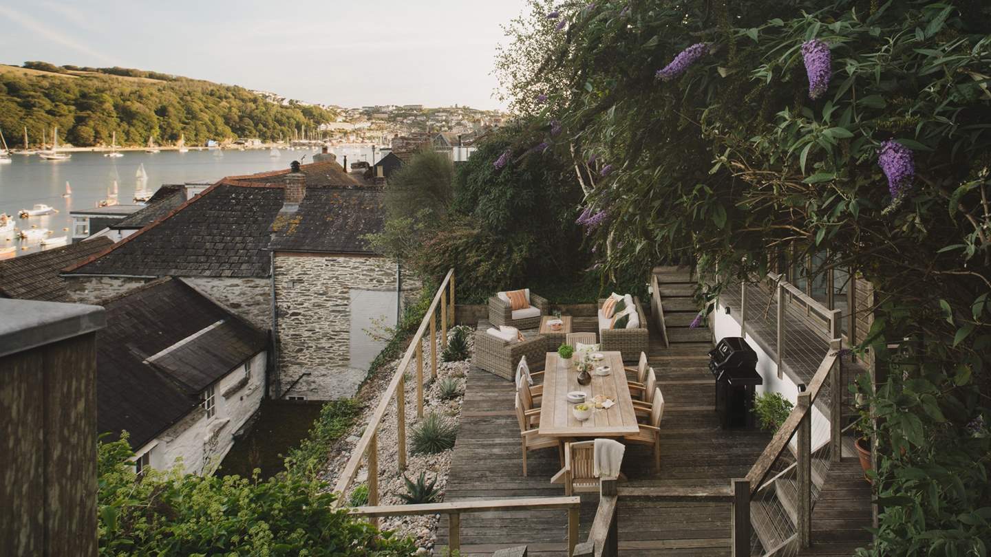 On the lower terrace awaits an array of outdoor seating, with a wooden table for eight made for sun-kissed banquets