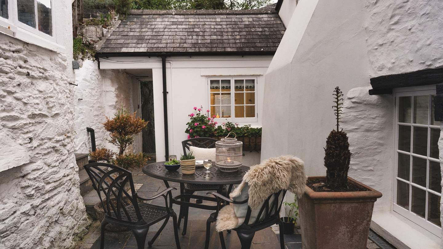 Step outside to uncover a charming courtyard, where a bistro table for four invites laidback lunches 