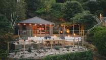 Set on the third tier is the wood-clad summer house
