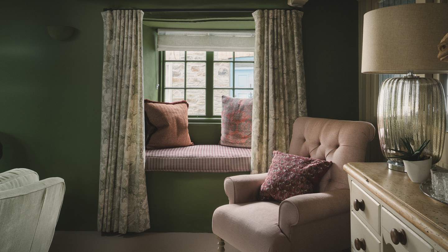 This darling space features two cosy window seats 