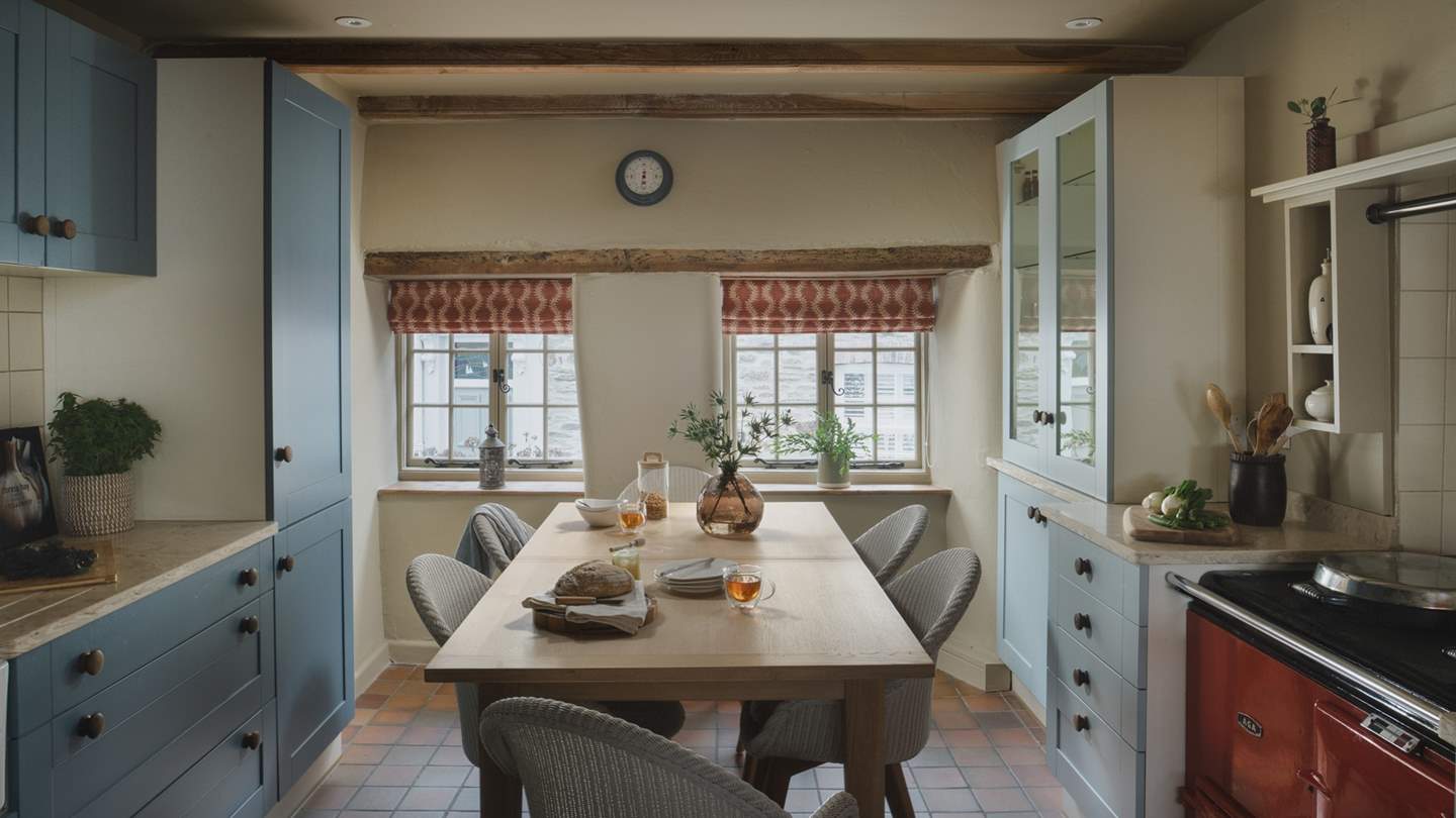 Country charm meets modern luxury in the stunning kitchen and dining space