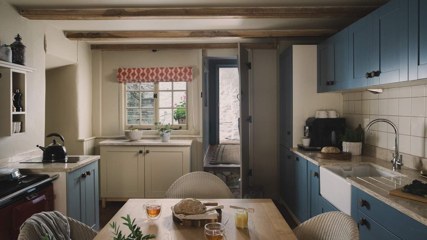 A wooden dining table for six sets the scene for staycation feasts