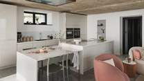 The space is complemented by bespoke cabinetry and an array of integrated features and Neff appliances