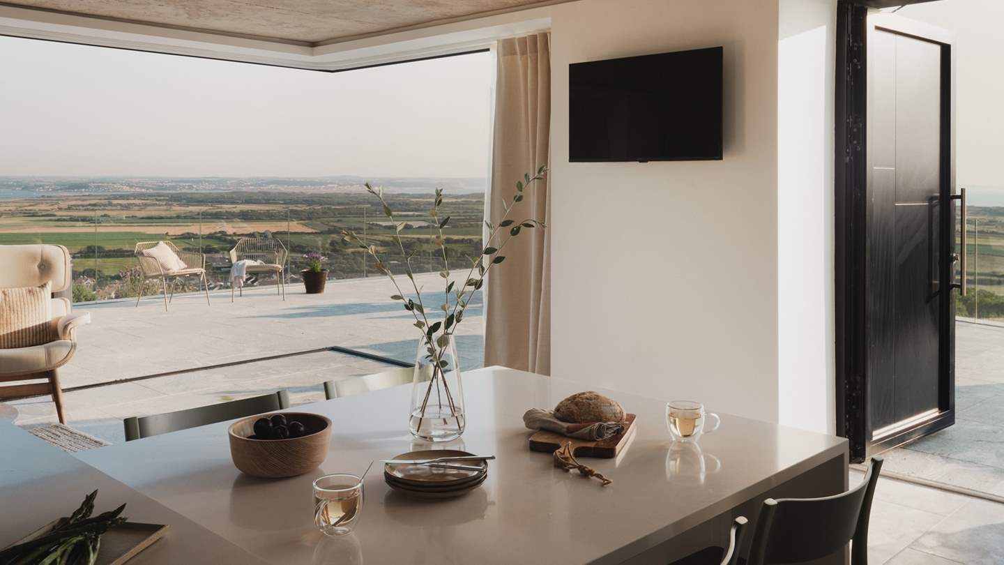 Adjoining the living room in an open-plan design, the contemporary kitchen and dining area of Fairlinch is a picture of perfection