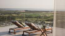 Unwind on the loungers during sun-kissed hours...