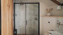 An ensuite bathroom awaits with a walk-in shower
