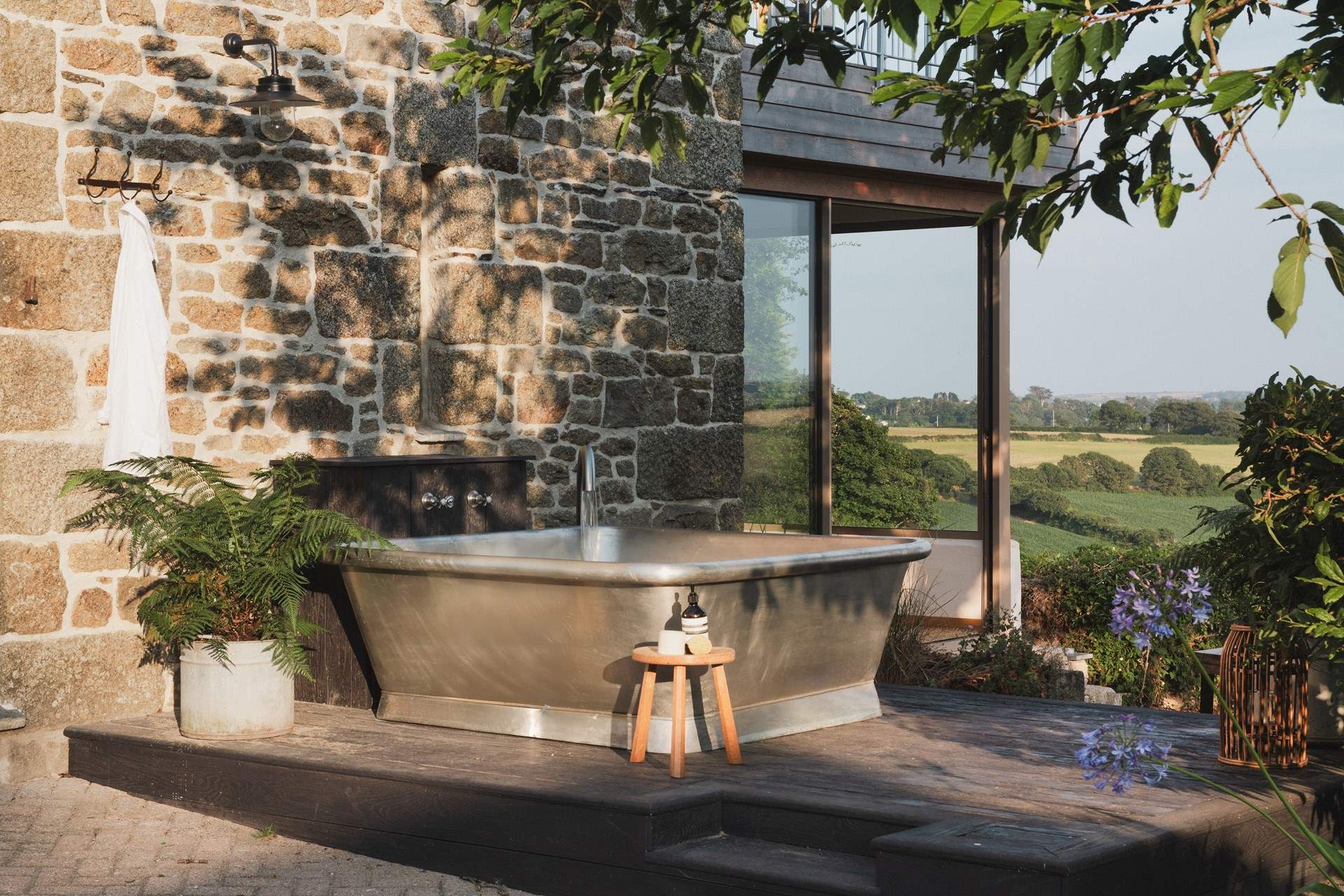 Overlooking the halcyon landscapes of South Cornwall, uncover our luxury retreat for ten...
