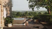 Promising utter contentment, a William Holland outside bath takes pride of place on the terrace 