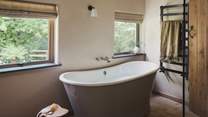 Savour bubble-topped moments in the freestanding bathtub