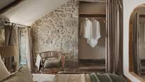 A hanging rail offer space for belongings