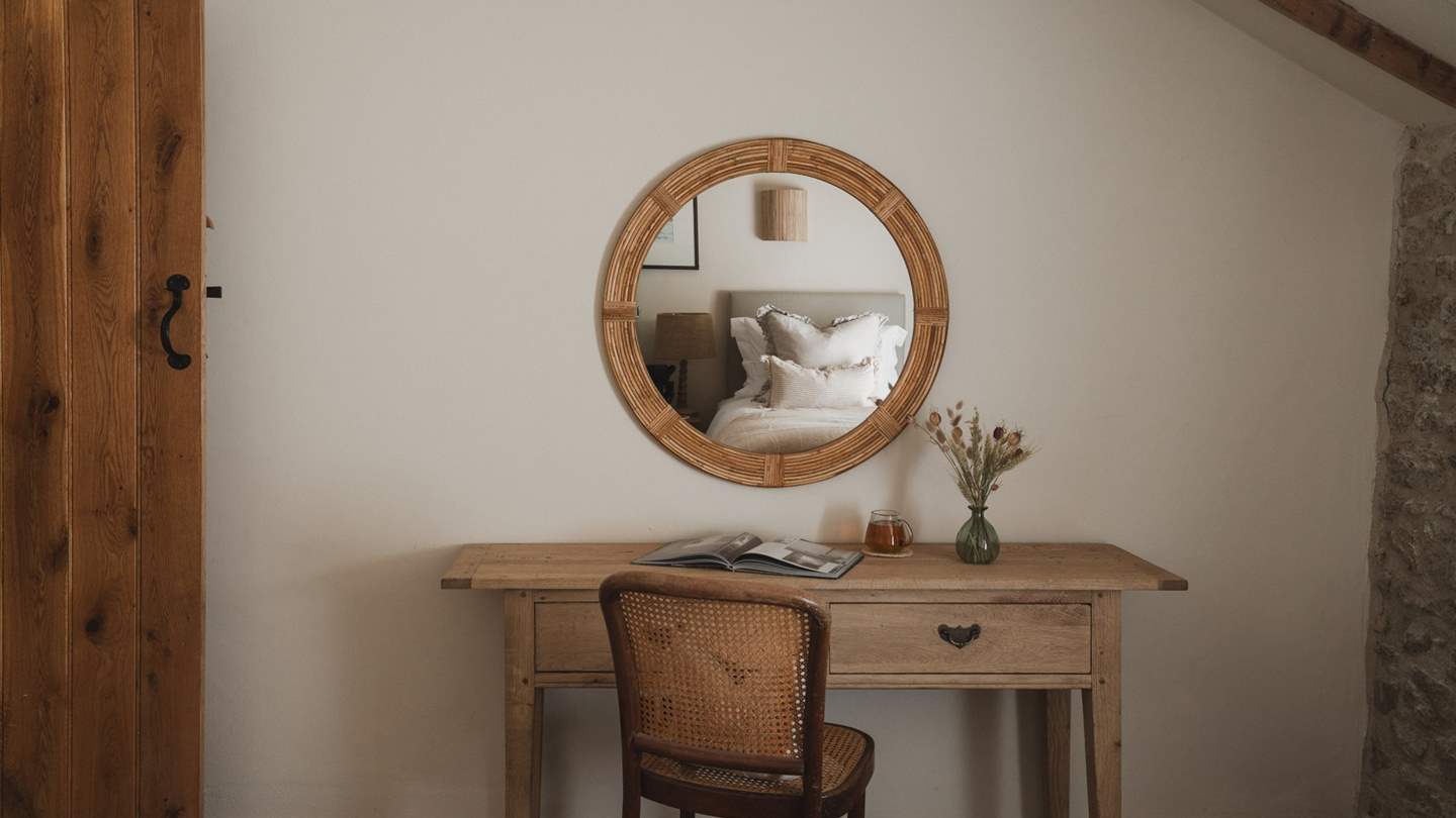 A dressing table resides at the far side of the room